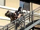 Security officer falls down stairs on a bike. A well deserved faceplant! :-P